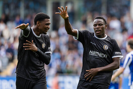 Josué Vergara and Hyllarion Goore of Gent celebrate