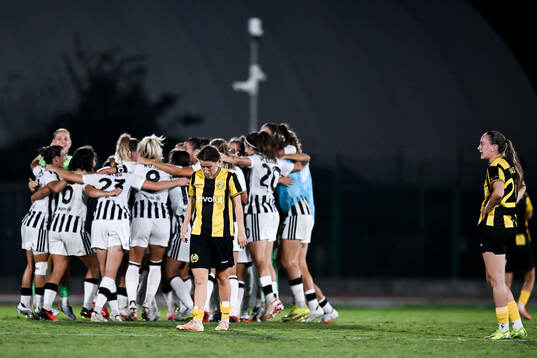 Players of Juventus celebrate and players of Hammarby