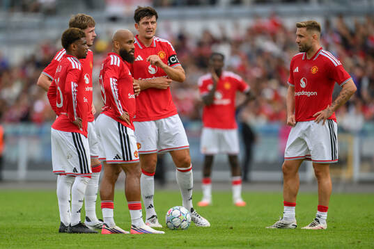 Manchester Uniteds Bryan Mbeumo, Harry Maguire  and Luke
