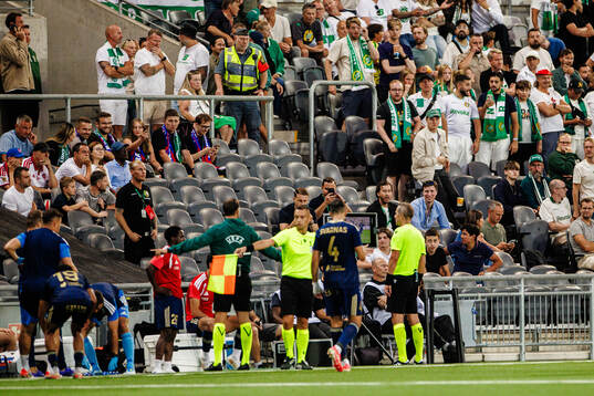 Referee Luca Pairetto is checking a potential penalty kick
