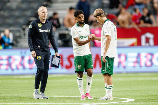 Tesfaldet Tekie and Markus Karlsson of Hammarby look