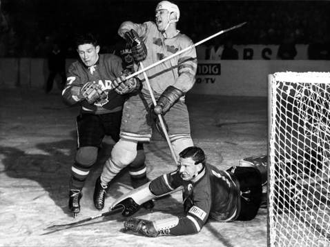 Team Sweden Sven Tumba is checked in front of the net by