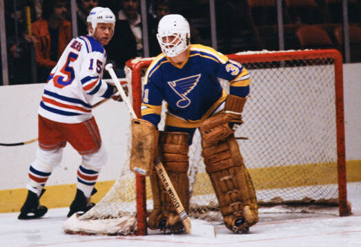 Anders Hedberg of New York Rangers and goalkeeper Ed