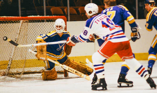 Walt Tkaczuk of New York Rangers shoots against goalkeeper