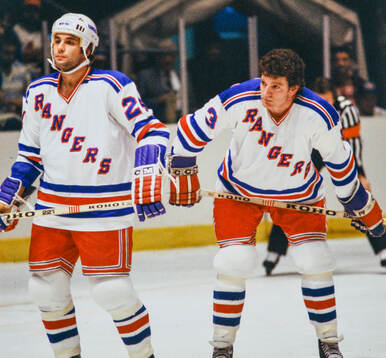 Pierre Plante and Barry Beck of New York Rangers
