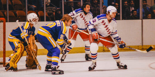 Goalkeeper Ed Staniowski and Neil Komadoski of St Louis