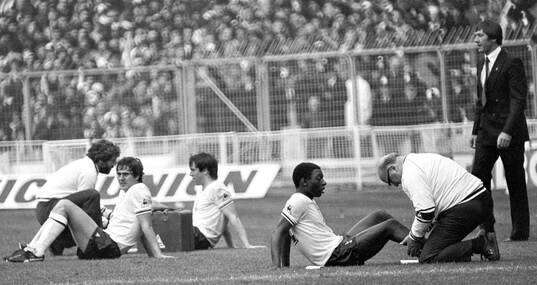 Tottenham manager Keith Burkinshaw overlooks his players