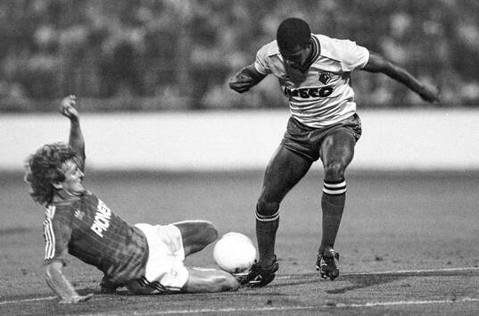 Russel Osman of Ipswich tackles John Barnes of Watford