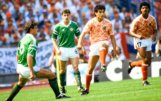Netherlands Gerald Vanenburg and Frank Rijkaard (R) against