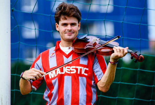 Anders Limpar of Cremonese with a violin
