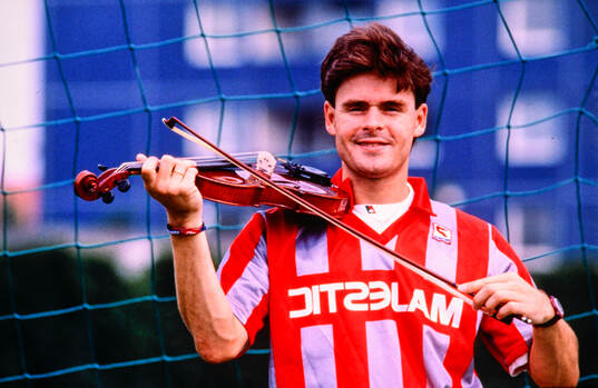 Anders Limpar of Cremonese with a violin