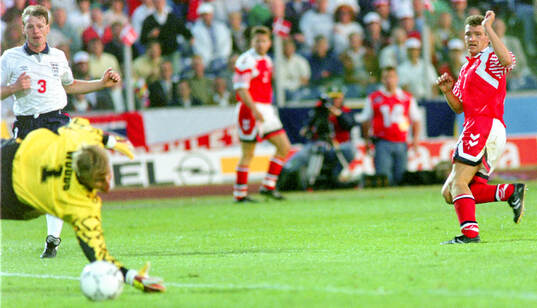 Englands goalkeeper Chris Woods watches a shot by Denmarks