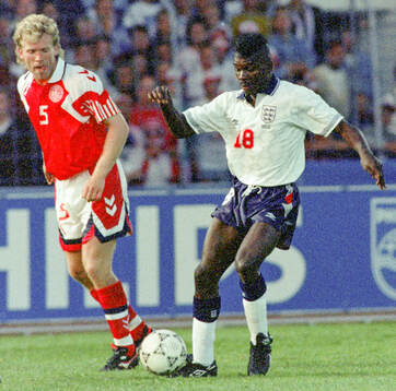 Englands Tony Daley against Denmarks Henrik Andersen
