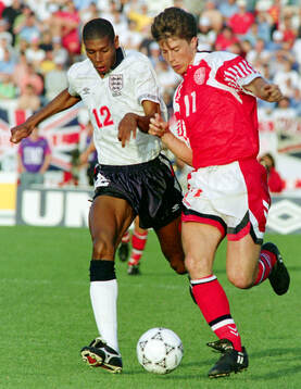 Denmarks Brian Laudrup (R) against Englands Carlton Palmer