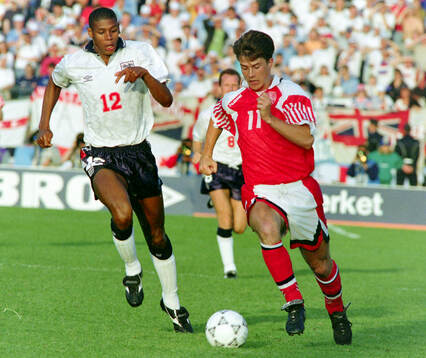 Denmarks Brian Laudrup (R) against Englands Carlton Palmer