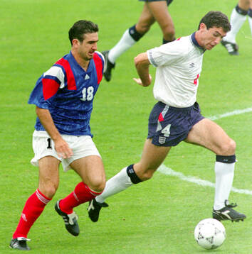 Eric Cantona of France against Martin Keown of England