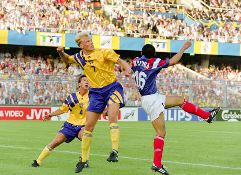 Swedens Klas Ingesson (C) and Patrik Andersson against