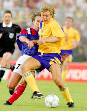 Swedens Tomas Brolin against Didier Deschamps of France