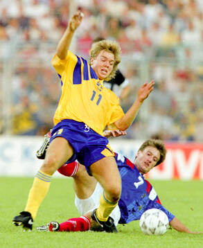 Swedens Tomas Brolin against Didier Deschamps of France