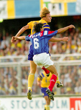 Swedens Kennet Andersson in an aerial duel against Barnard