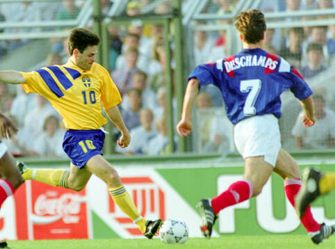 Swedens Anders Limpar shoots, right Didier Deschamps of