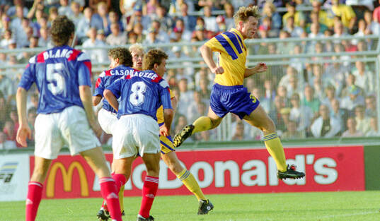 Swedens Jan Eriksson scores the first goal with a header