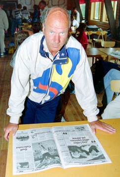 Swedish manager Tommy Svensson reads sports pages about the