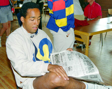 Swedish player Martin Dahlin reads sports pages about the