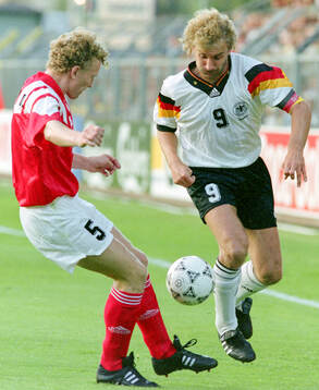 Germanys Rudi Voller against Oleg Kuznetsov of CIS