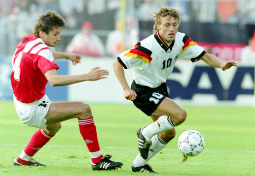 Germanys Thomas Doll against Vladimir Liotyi of CIS