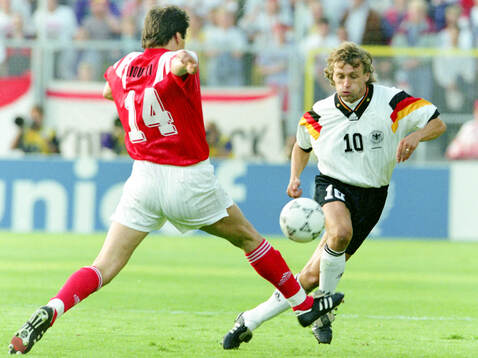 Germanys Thomas Doll against Vladimir Liotyi of CIS