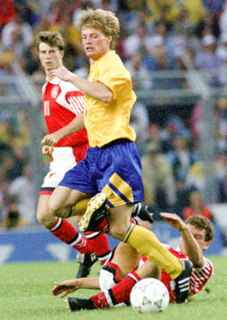 Swedens Stefan Schwarz is tackled by Denmarks John Jensen