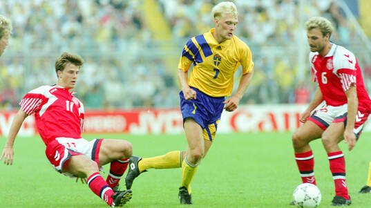 Swedens Klas Ingesson against Denmarks Brian Laudrup (L)