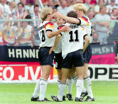 Germanys Karl-Heinz Riedle celebrates his 1-0 goal with