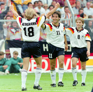 Germanys Karl-Heinz Riedle (C) celebrates his 1-0 goal with