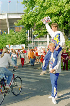 Vendors selling match programmes outside Nya Ullevi Stadium