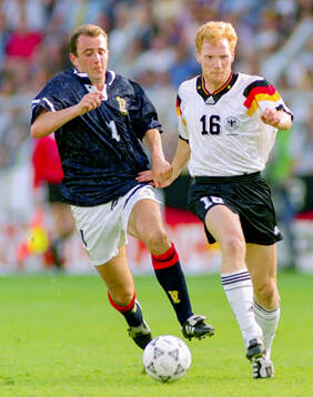 Scotlands Gary McAllister against Germanys Matthias Sammer