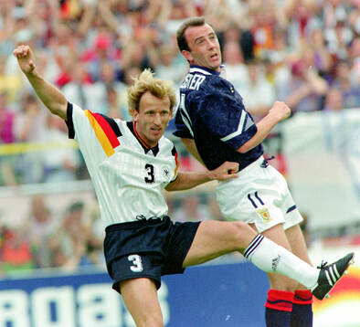 Germanys Andreas Brehme against Scotlands Gary McAllister