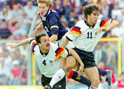 Germanys Jurgen Kohler (L) and Karl-Heinz Riedle against