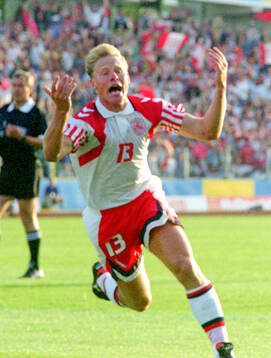 Denmarks Henrik Larsen celebrates his 1-0 goal