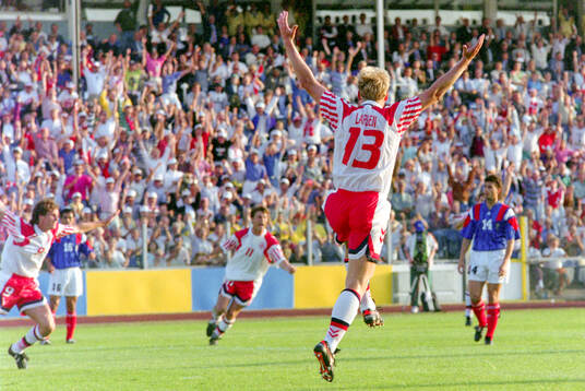 Denmarks Henrik Larsen celebrates his 1-0 goal