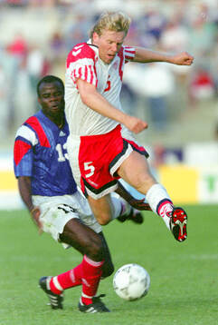 Denmarks Henrik Andersen against France‚Äôs Basile Boli