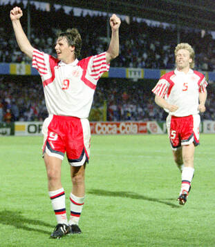 Denmarks Flemming Povlsen (L) and Henrik Andersen celebrates
