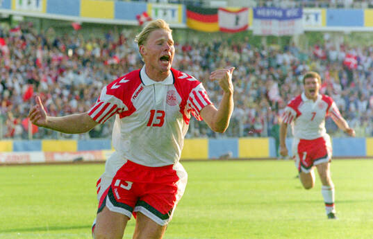 Denmarks Henrik Larsen celebrates his 1-0 goal