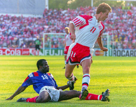 Denmarks Brian Laudrup against Basile Boli of France