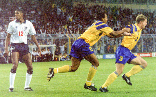 Swedens Jan Eriksson (R) celebrates his equalizing goal for