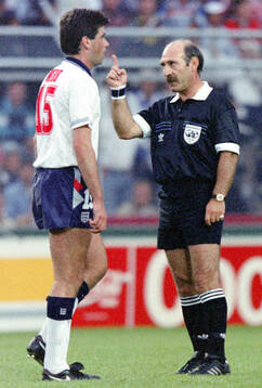 Referee Jose dos Santos and Englands Neil Webb