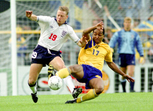 Englands David Batty against Swedens Martin Dahlin