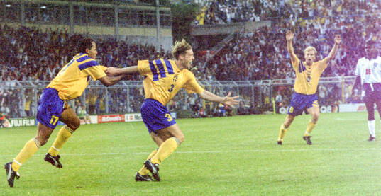 Swedens Jan Eriksson (C) celebrates his equalizing goal for