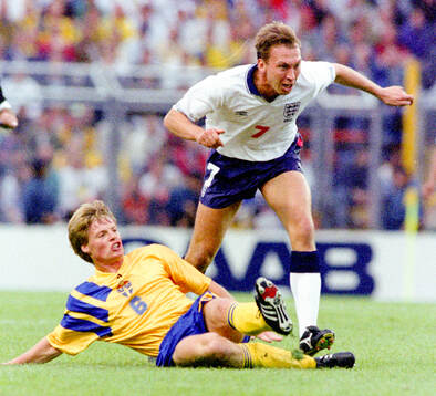 Swedens Stefan Schwarz tackles Englands David Platt